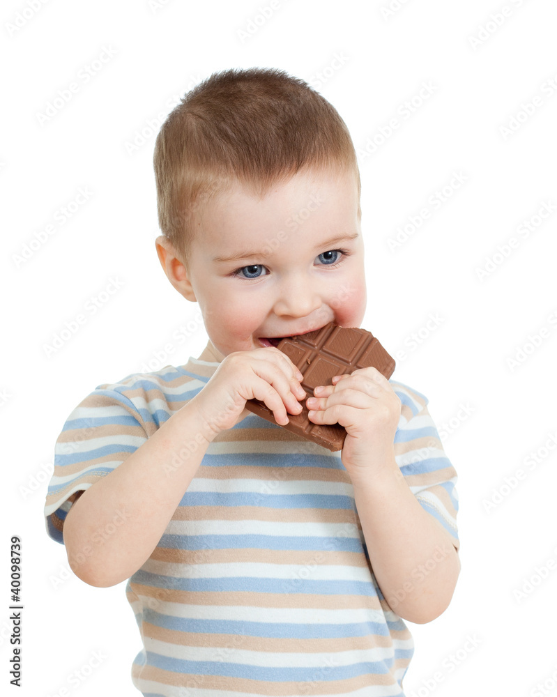 child boy eating chocolate isolated on white child boy eating chocolate isolated on white