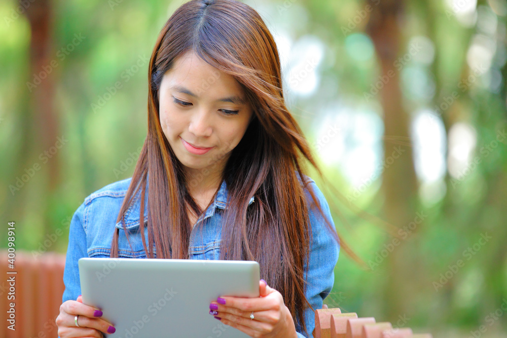 young asian woman with tablet computer outdoor young asian woman with tablet computer outdoor