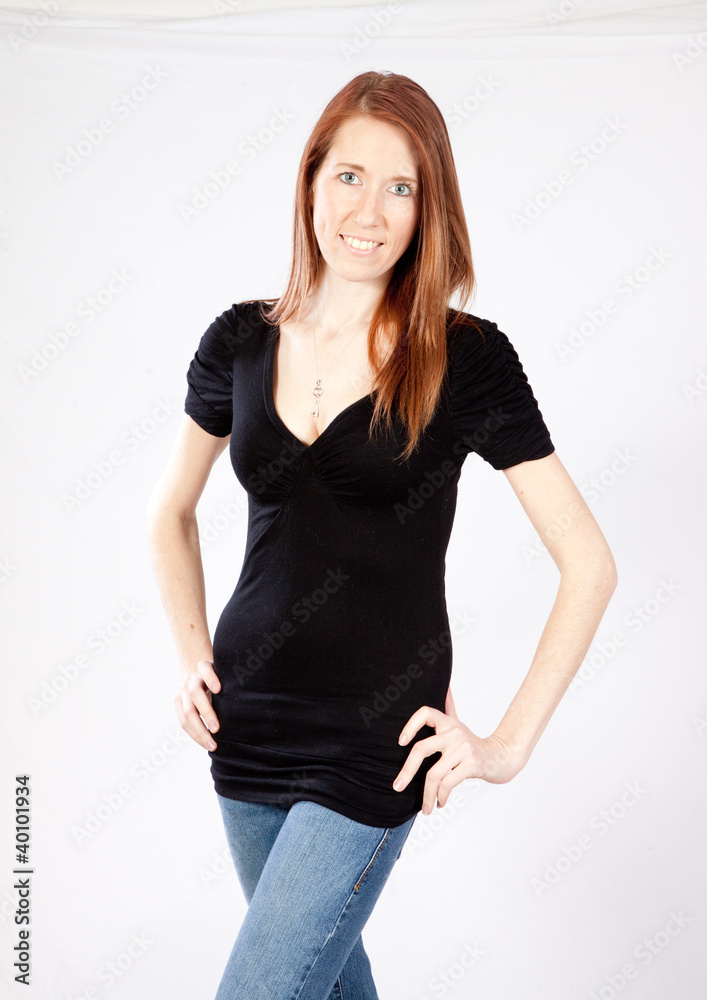 woman standing and smiling at the camera woman standing and smiling at the camera
