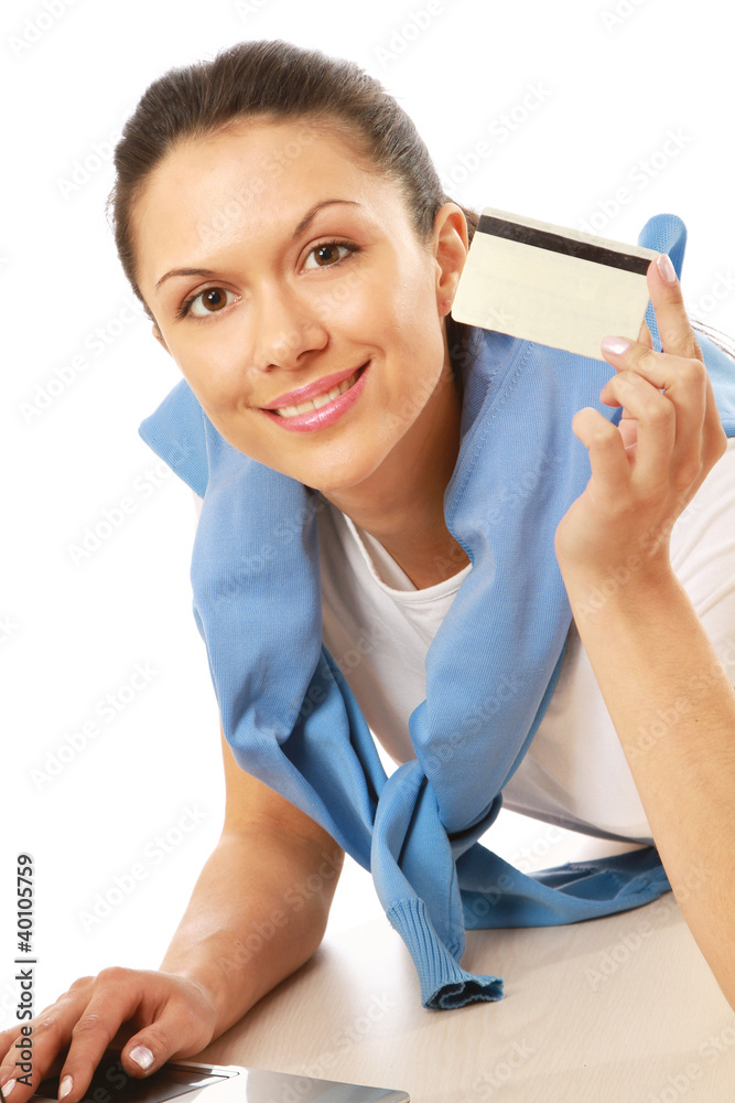 A woman with a laptop and a credit card A woman with a laptop and a credit card