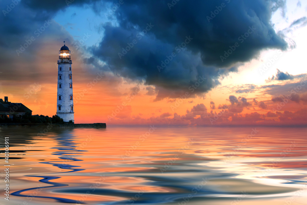 Beautiful nightly seascape with lighthouse and moody sky