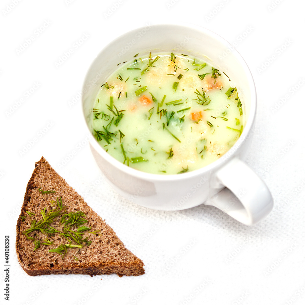 a cup of instant soup and a slice of bread
