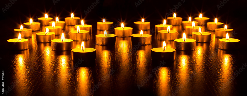 Panorama of the many burning candles Panorama of the many burning candles