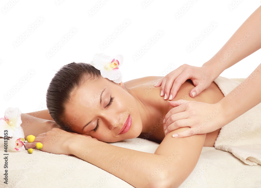 An attractive woman getting spa treatment isolated on white