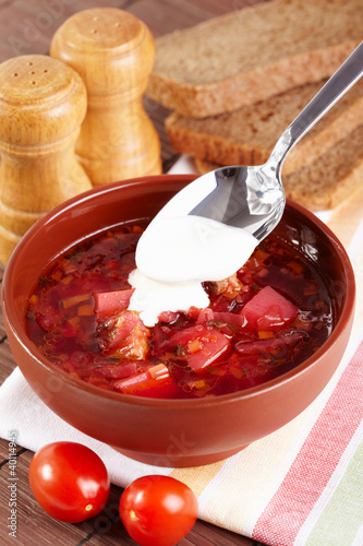 Russian cuisine. Borscht on the served table