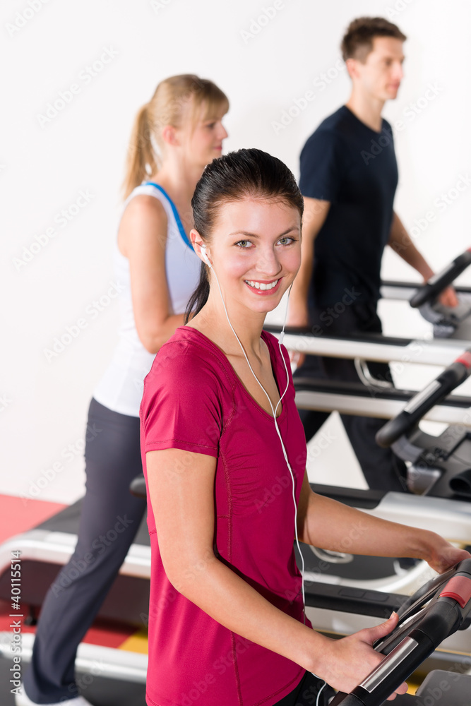 Young people on treadmill running exercise Young people on treadmill running exercise
