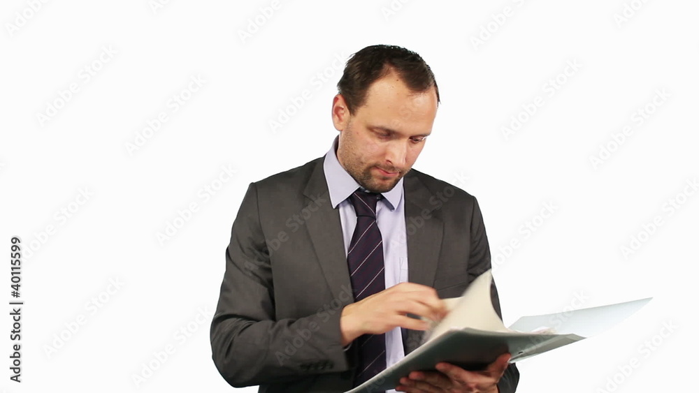Businessman reading documents, isolated on white Businessman reading documents, isolated on white