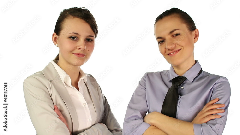 Two successful businesswomen with hands crossed, isolated Two successful businesswomen with hands crossed, isolated