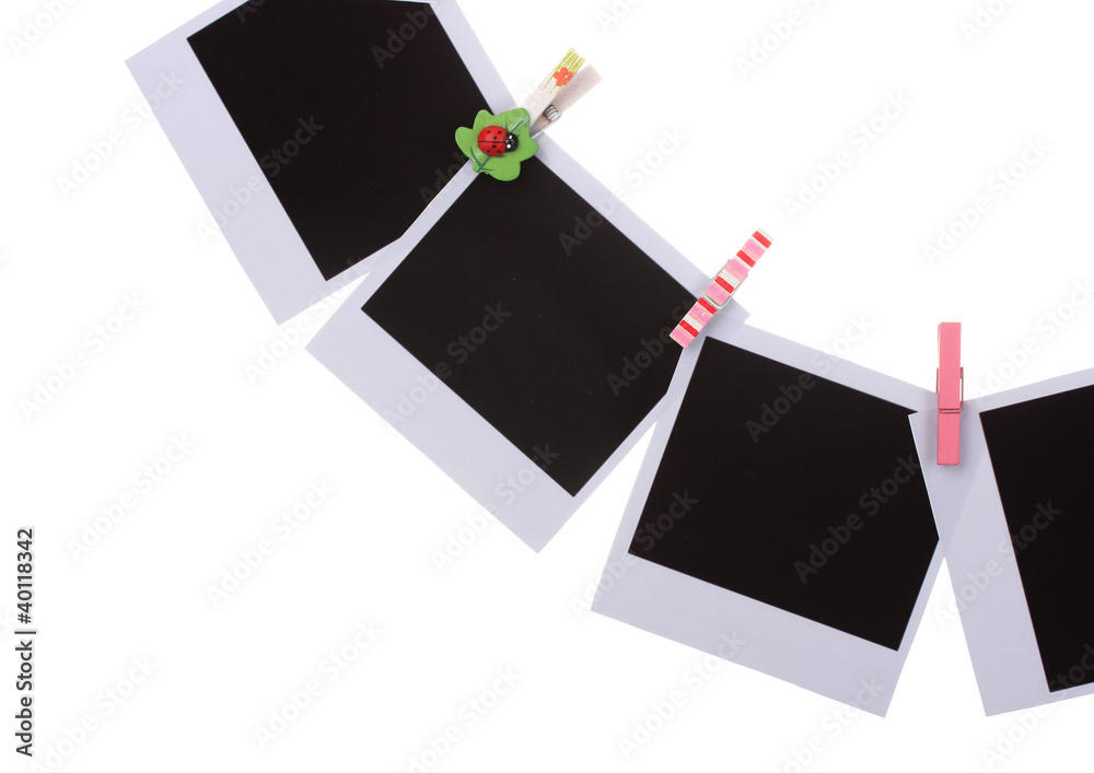 Photo paper hanging on the clothesline isolated on white Photo paper hanging on the clothesline isolated on white