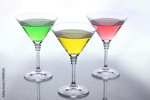 alcoholic cocktails on table isolated on white