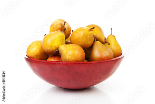 Red bowl with fresh pears
