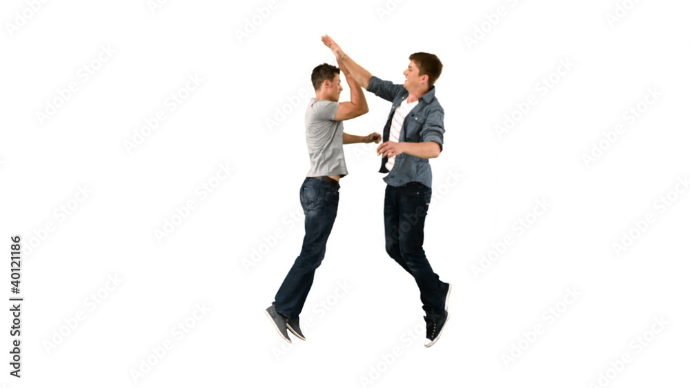 Two guys high-fiving one another in slow motion