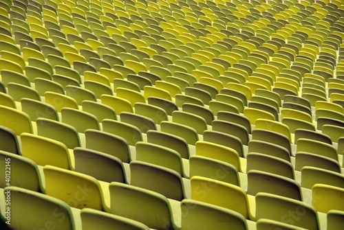 A pattern of green seats in a sport stadium