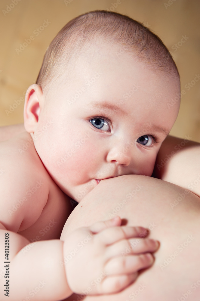Mother breast feeding her infant Mother breast feeding her infant