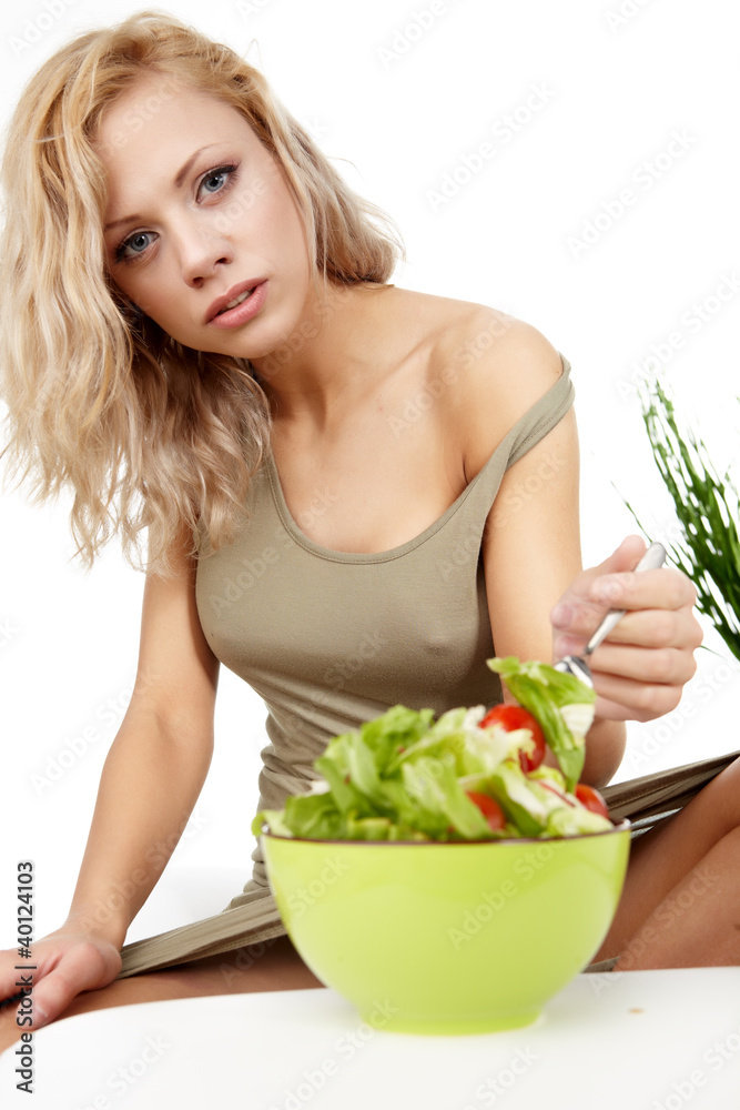 Portrait of young happy smiling woman eating salad Portrait of young happy smiling woman eating salad