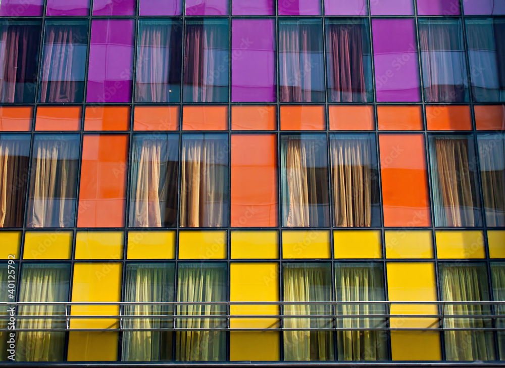 Colorful windows on modern apartment block Colorful windows on modern apartment block