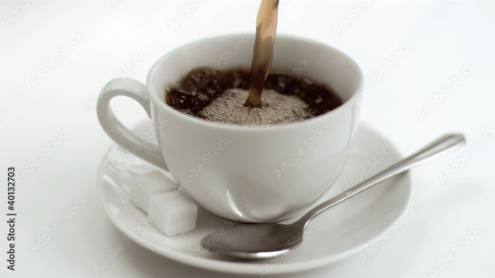 Americano coffee in super slow motion filling a cup Americano coffee in super slow motion filling a cup