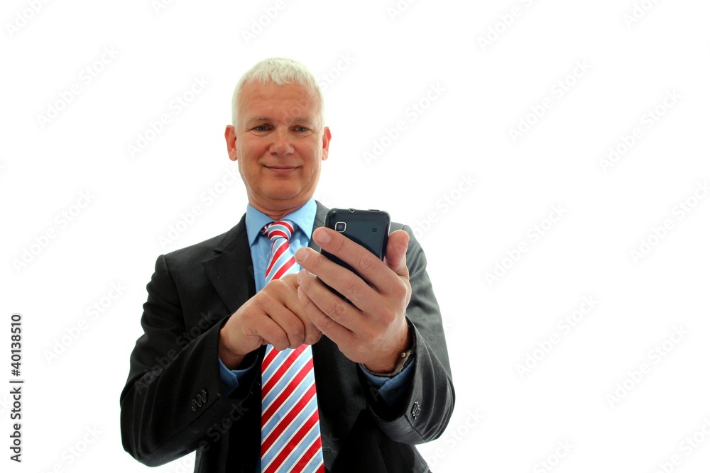 Geschaeftsmann mit Handy von unten Geschaeftsmann mit Handy von unten