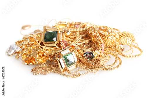 Various gold jewellery isolated on white
