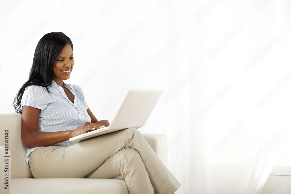 Beautiful friendly young woman working on laptop Beautiful friendly young woman working on laptop
