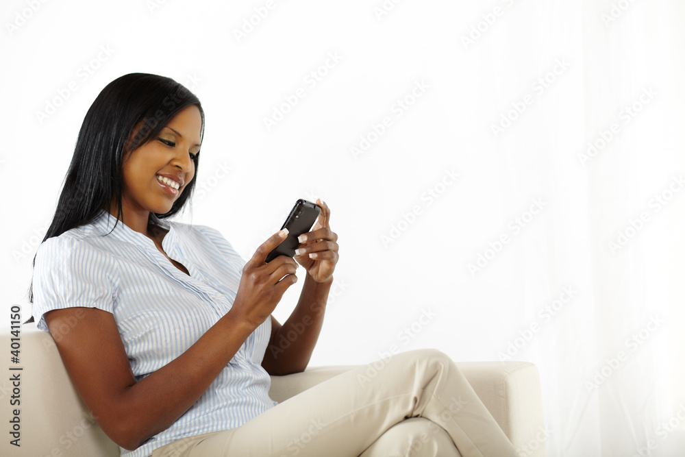 Happy young woman using a mobile phone Happy young woman using a mobile phone