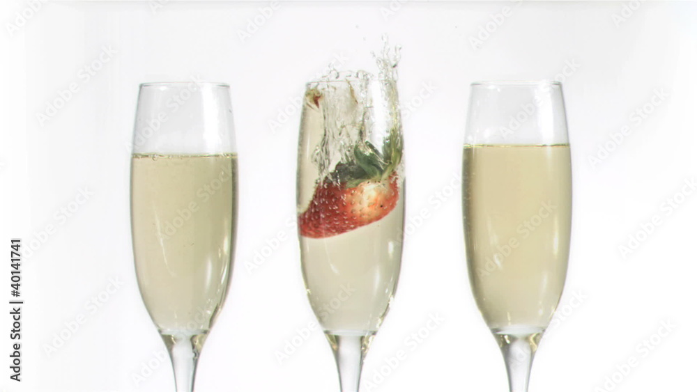 Strawberry falling in super slow motion in a glass Strawberry falling in super slow motion in a glass