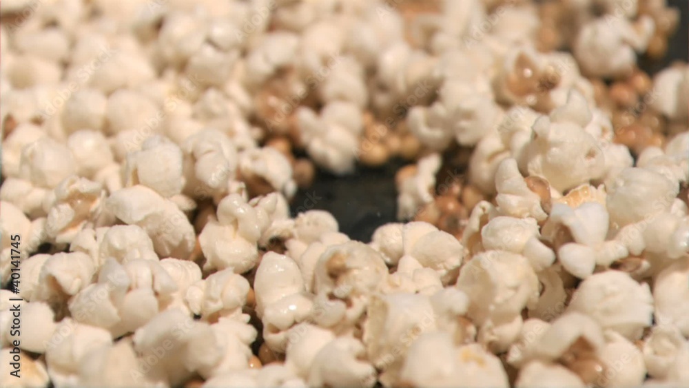 Popcorn cooking in super slow motion on a pan Popcorn cooking in super slow motion on a pan