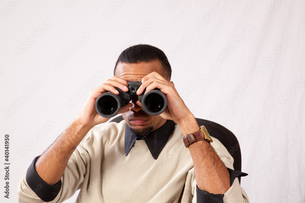 black man looking through binoculars black man looking through binoculars