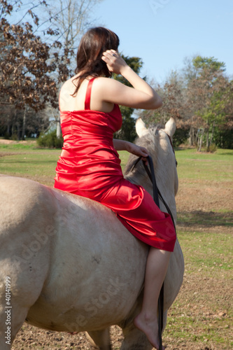 woman in red dress riding bareback