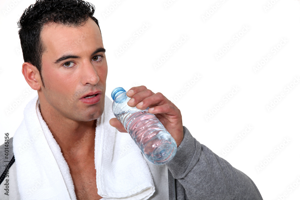Athlete drinking water after physical effort