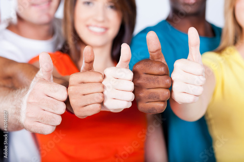 group of multiracial friends thumbs up #40148187