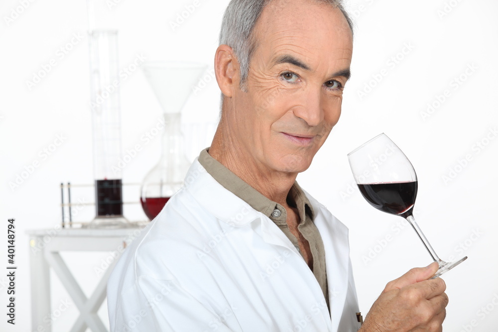 Oenologist analysing a wine Oenologist analysing a wine