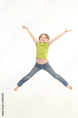 Girl jumping isolated on white background