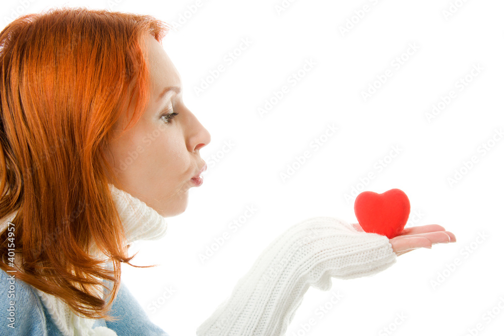 The girl sends an air kiss in the form of heart The girl sends an air kiss in the form of heart