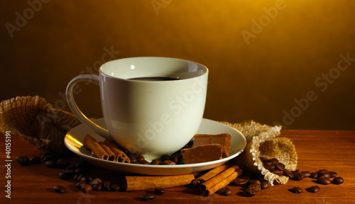 cup of coffee and beans, cinnamon sticks and chocolate