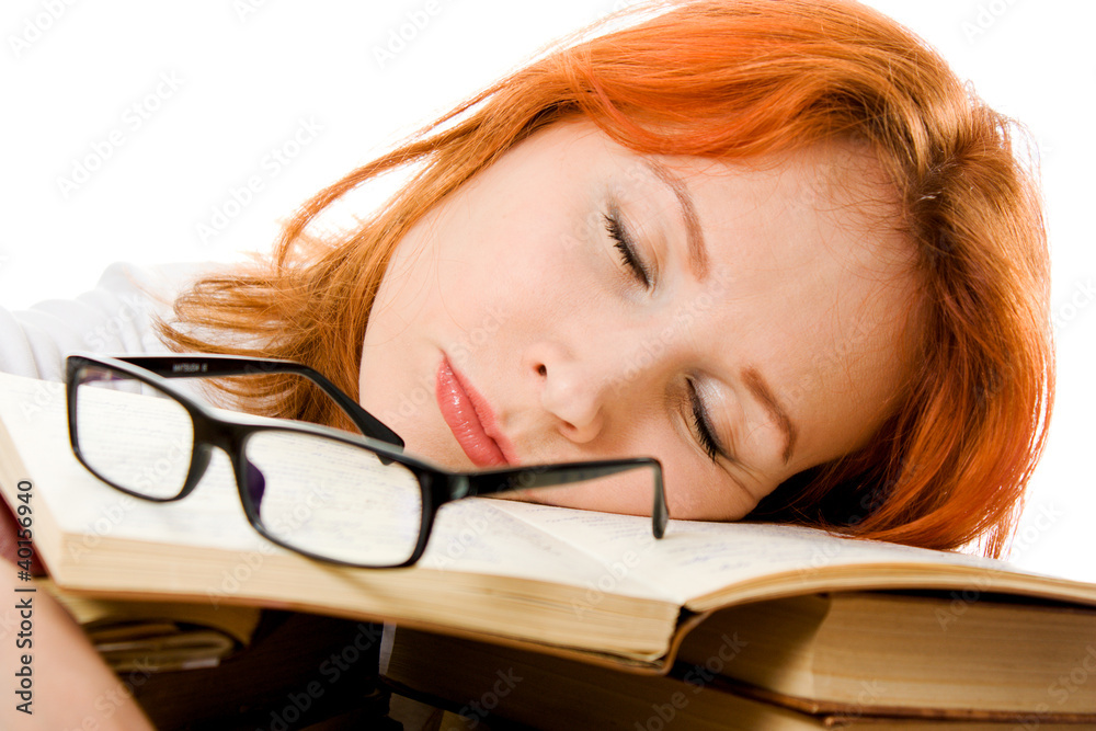 Beautiful red-haired girl in glasses reads book. Beautiful red-haired girl in glasses reads book.