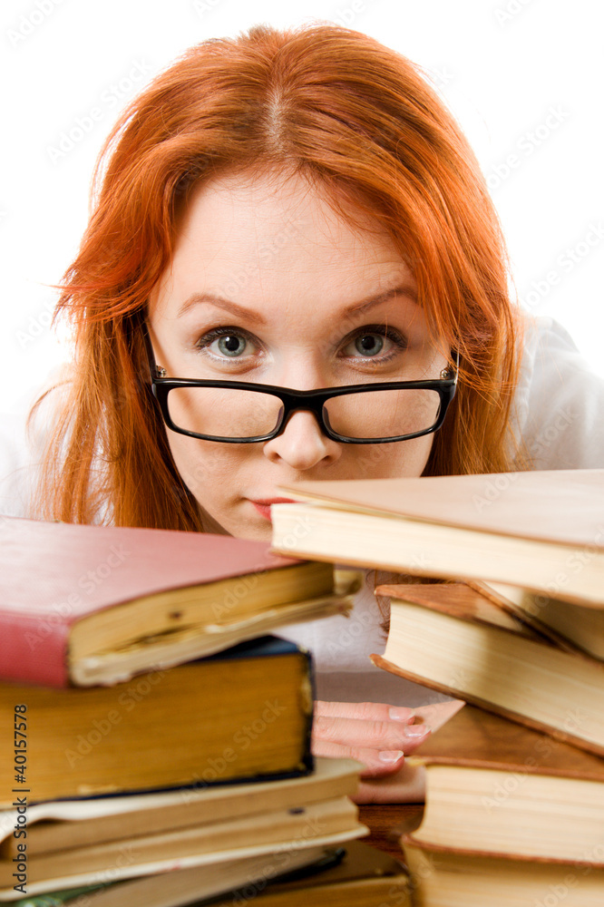 Beautiful red-haired girl in glasses reads book. Beautiful red-haired girl in glasses reads book.