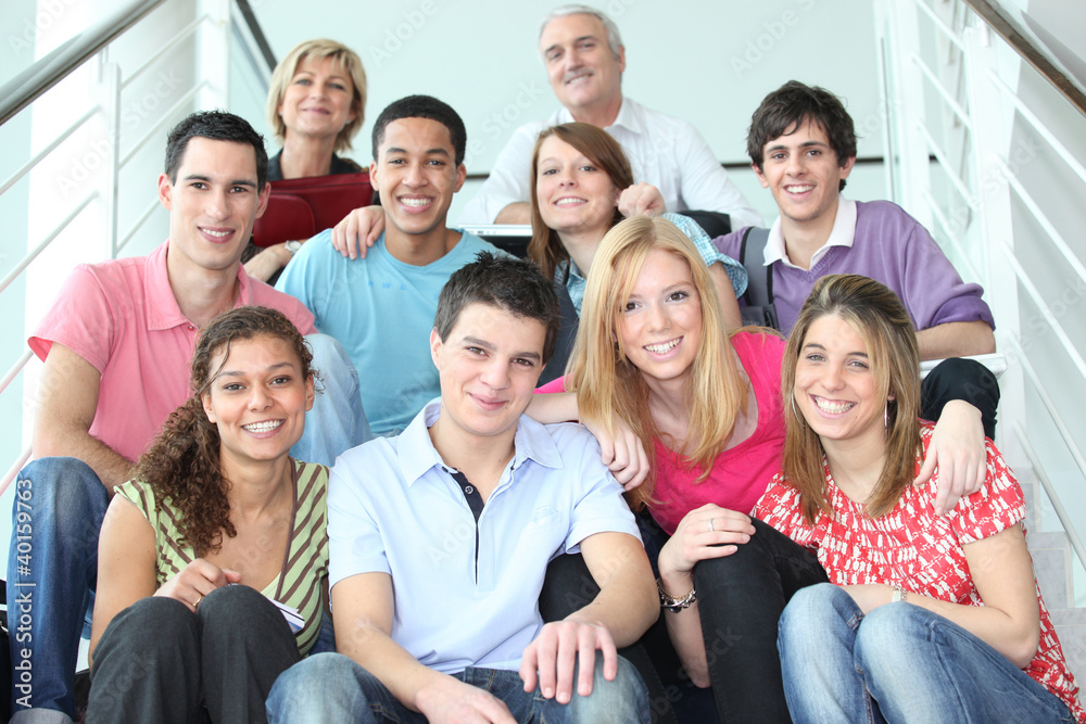Group of young people sitting on stairs Group of young people sitting on stairs
