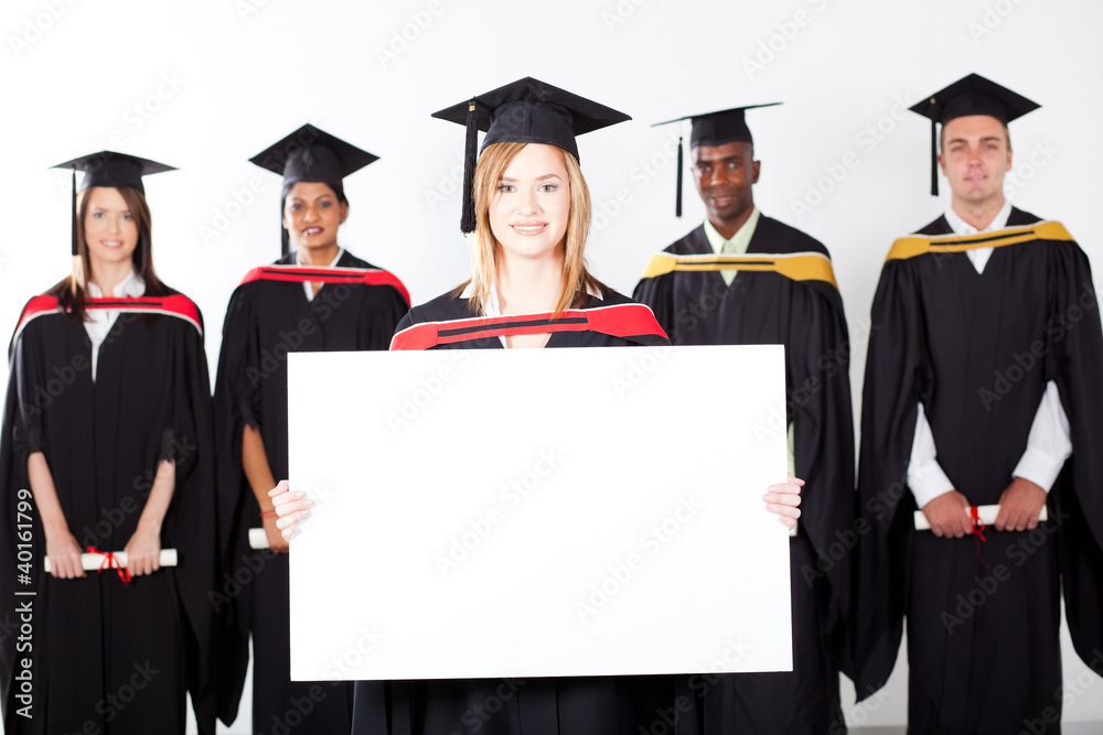 pretty female graduate holding white board pretty female graduate holding white board