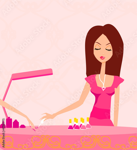 Young lady doing manicure in beauty salon