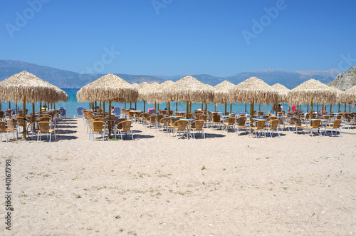 Sunbeds and umblellas on a beach in a morning