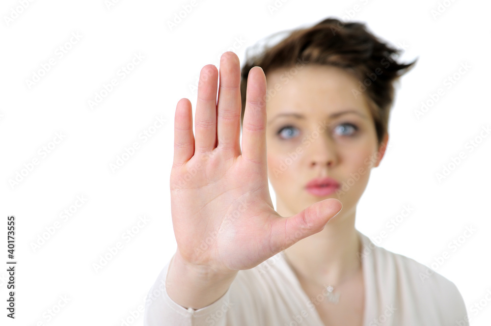 Picture of young woman making stop gesture Picture of young woman making stop gesture