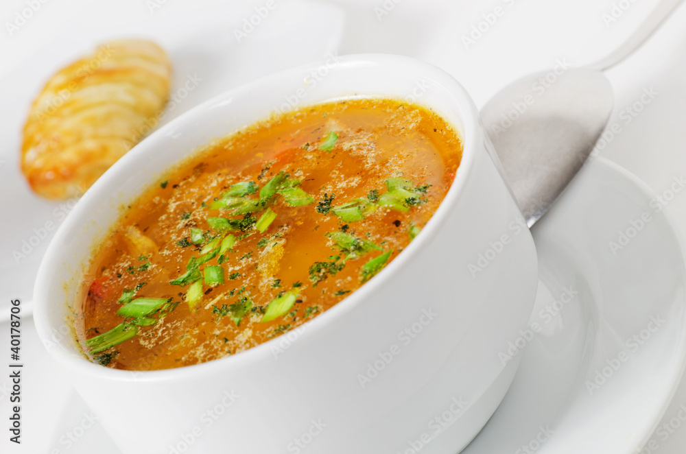 Fresh fish soup on white background