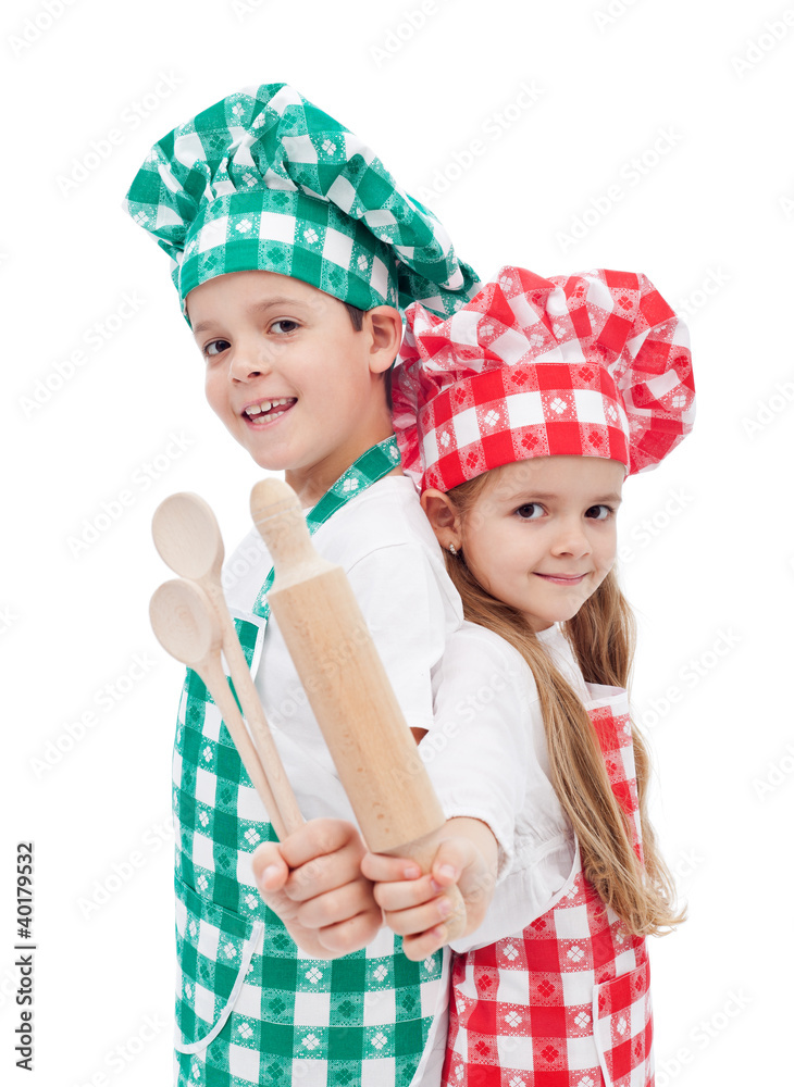 Happy chef kids with wooden cooking utensils Happy chef kids with wooden cooking utensils