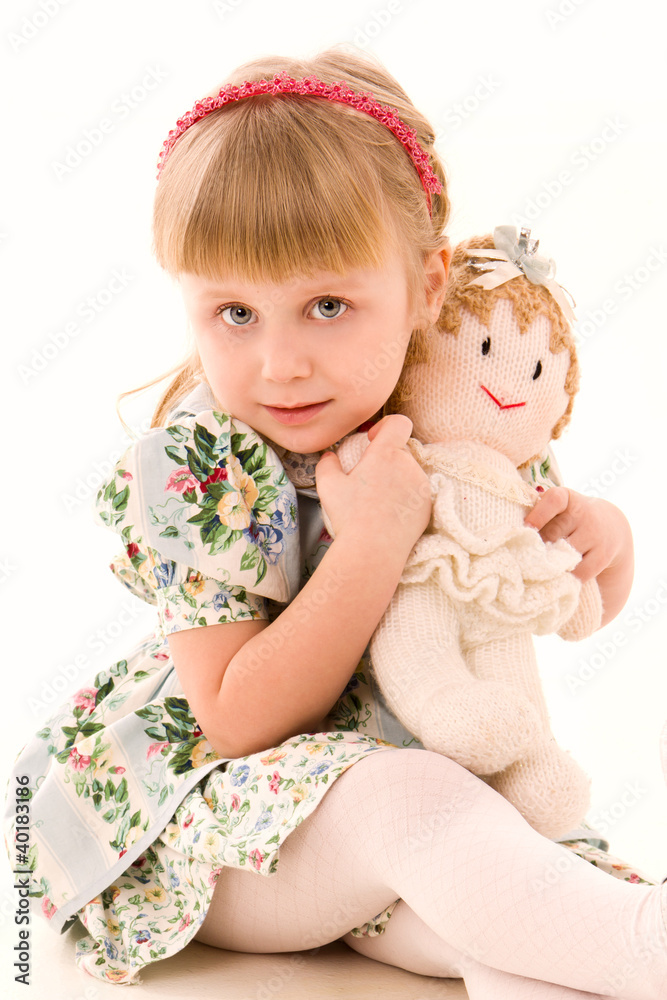 Portrait of happy little girl with a doll Portrait of happy little girl with a doll