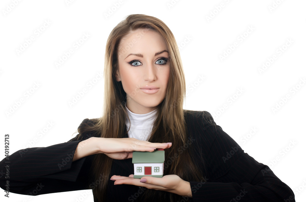 The business woman with small model of the house The business woman with small model of the house