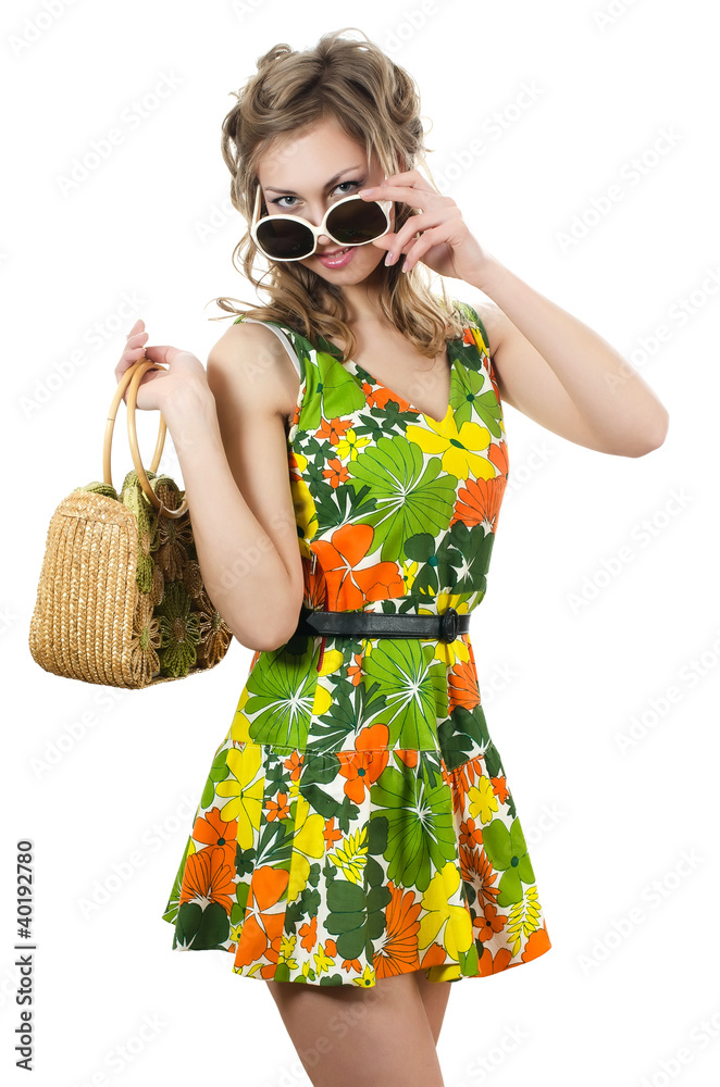 The beautiful girl in a summer dress isolated The beautiful girl in a summer dress isolated
