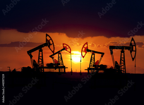 Collage. Oil field at sunset.