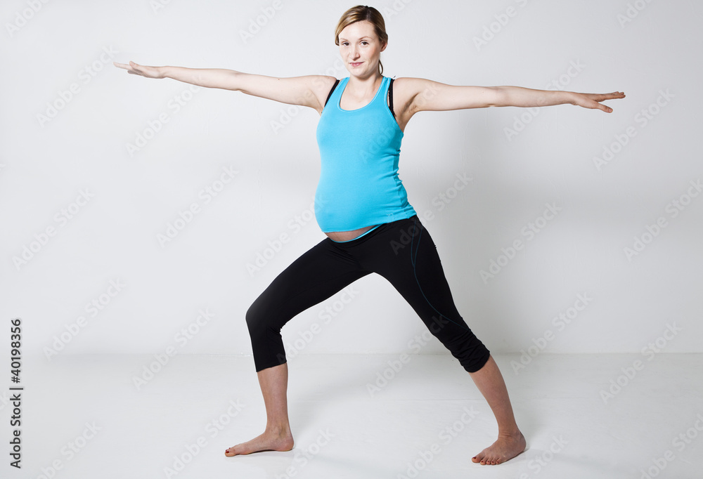 Fototapeta premium Pregnant woman doing yoga exercise