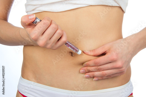 Diabetes dependent female doing human insulin shot